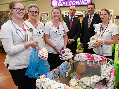 United Way President and CEO Michael Weiner (left) and ECMC President and CEO Thomas Quatroche pause for a photo to thank ECC Nursing Students who donated baby items along with many ECMC staff members during the United Way Community Baby Shower appreciation event held April 27.