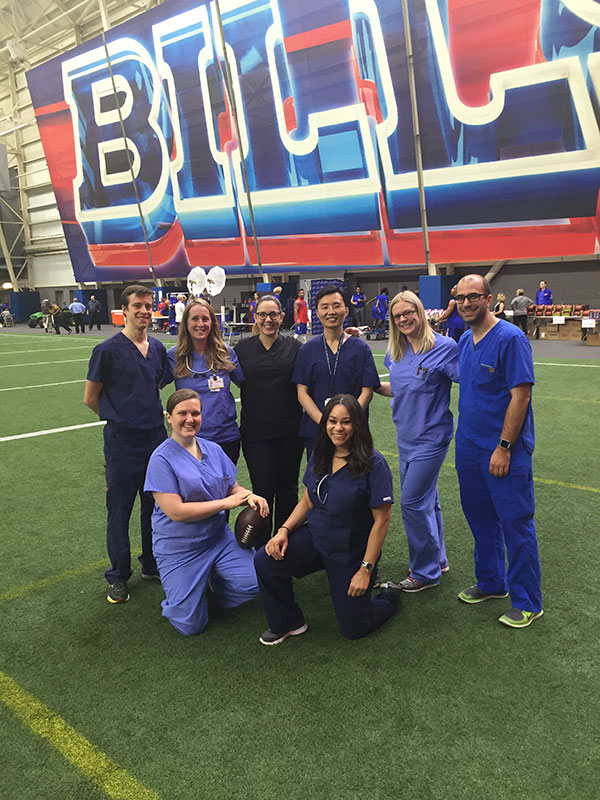 On June 13, 2016, ECMC Dental Residents conducted daylong dental exams and oral hygiene screening for Buffalo Bills players at the team’s training facility in Orchard Park.  